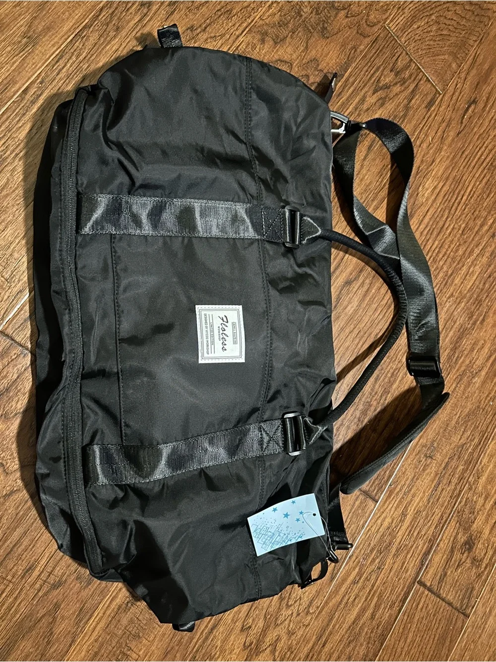 black Floless Workshop limited edition duffel bag with toiletry bag
